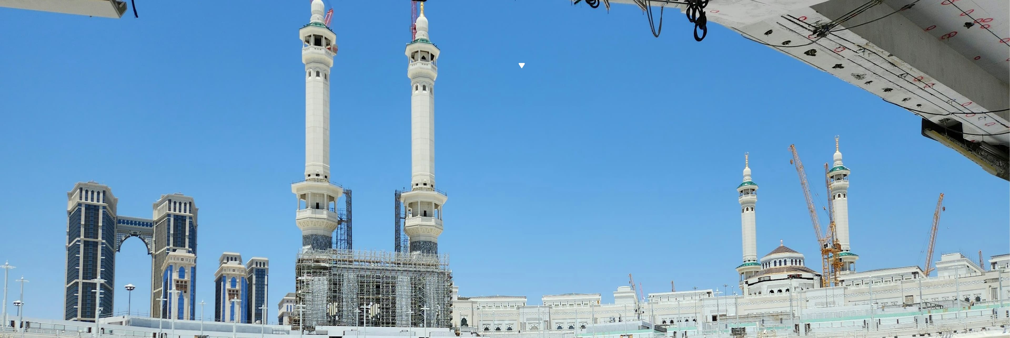 Makkah mosque towers under a clear blue sky